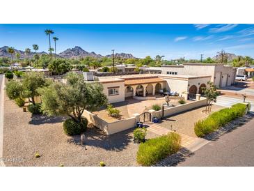 Aerial view of a stunning property with a large backyard, pool, and expansive patio at 3357 E Gold Dust Ave, Phoenix, AZ 85028