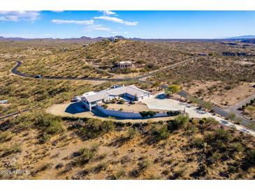 Aerial view of a single-story house with desert landscape at 51008 N 295Th Ave, Wickenburg, AZ 85390