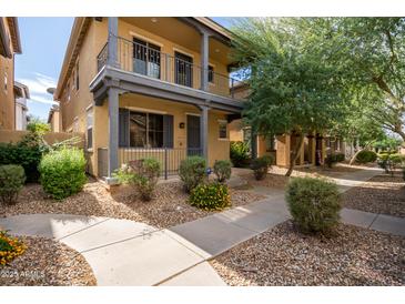 Two-story townhome with front porch and landscaped yard at 6845 S 7Th Ln, Phoenix, AZ 85041