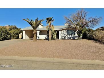 Cute single-story home with a desert landscaping front yard at 8738 W Tinajas Dr, Arizona City, AZ 85123