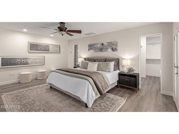 Spacious bedroom with plush bedding and ample closet space at 17052 N 36Th Ct, Phoenix, AZ 85032