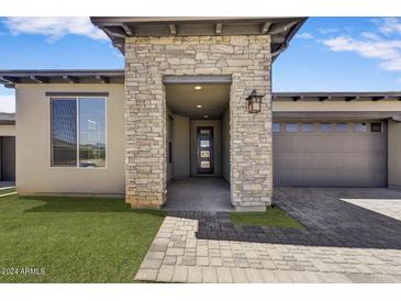 Craftsman style home with stone accents and a 2-car garage at 18221 E Paria Canyon Dr, Rio Verde, AZ 85263