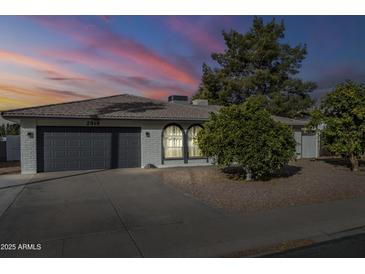 Beautiful single-story home with a gray garage door and landscaping at 2818 S Cottonwood Dr, Tempe, AZ 85282