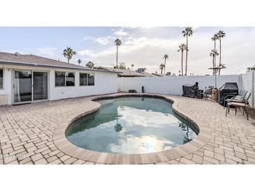 Inviting kidney-shaped pool in a sunny backyard at 2818 S Cottonwood Dr, Tempe, AZ 85282