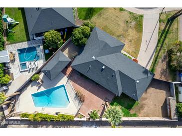 Aerial view of a house with a pool and landscaped yard at 4728 E Mulberry Dr, Phoenix, AZ 85018