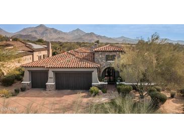 Stunning desert home with a tile roof and mountain views at 9111 E Mountain Spring Rd, Scottsdale, AZ 85255