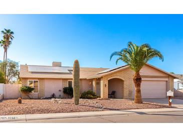 One-story home with solar panels and desert landscaping at 1243 E Avenida Grande --, Casa Grande, AZ 85122
