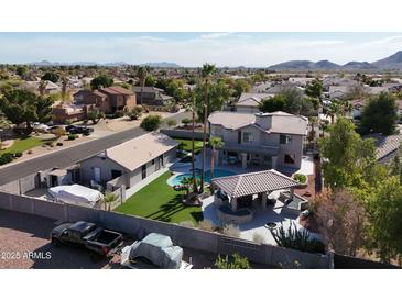 Aerial view of two-story home with pool, casita and large backyard at 4530 W Misty Willow Ln, Glendale, AZ 85310