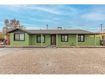 Charming single-story home with a covered entry and a well-maintained gravel yard at 4602 N 47Th Ave, Phoenix, AZ 85031