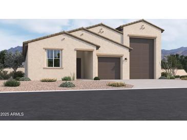 Tan two-story house with a large brown garage door and landscaping at 47250 W Mellen Ln, Maricopa, AZ 85139