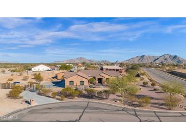 Aerial view of a single-story house with a large yard and mountain views at 12692 W Toltec Cir, Casa Grande, AZ 85194