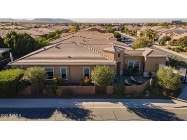 Luxury home with tile roof, courtyard, and desert landscaping at 1397 E Verde Blvd, Queen Creek, AZ 85140