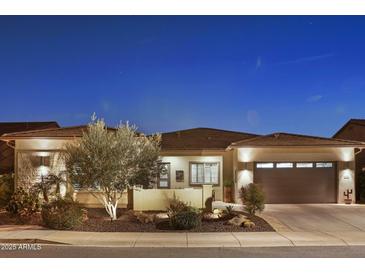 Attractive single-story home with desert landscaping and a three-car garage at 29512 N Tarragona Dr, Peoria, AZ 85383