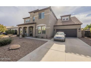 Two-story house with a large driveway and landscaped front yard at 3151 E Turnberry Dr, Gilbert, AZ 85298