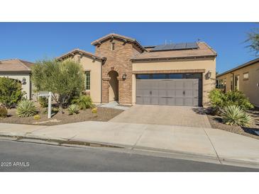 Beautiful brick home with a two-car garage at 316 E Leverenz Ave, Queen Creek, AZ 85140