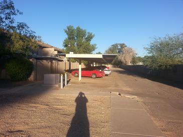 Covered parking area with ample space for residents' vehicles at 5813 N 59Th Dr, Glendale, AZ 85301