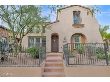 Two-story home with Spanish-style architecture and a landscaped front yard at 9236 E Canyon View Rd, Scottsdale, AZ 85255