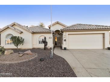 Single-story house with a two-car garage and desert landscaping at 1621 E Firestone Dr, Chandler, AZ 85249