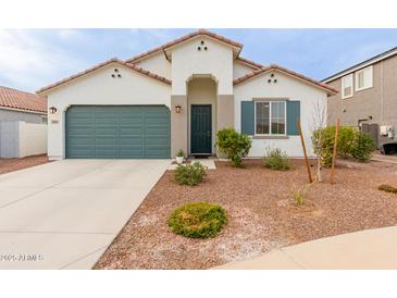 One-story home with green garage door and landscaped front yard at 2891 N Westridge Ln, Casa Grande, AZ 85122