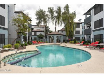 Community pool with spa and lounge chairs at 3848 N 3Rd Ave # 1044, Phoenix, AZ 85013