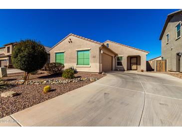 Single-story home with a two-car garage and desert landscaping at 790 W Jardin Dr, Casa Grande, AZ 85122