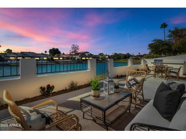 Relaxing patio with water views and outdoor seating at 8165 E Del Cuarzo Dr, Scottsdale, AZ 85258