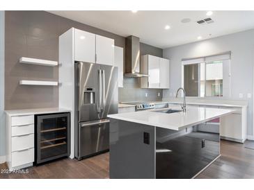 Modern kitchen with stainless steel appliances and island at 16510 N 92Nd St # 1003, Scottsdale, AZ 85260