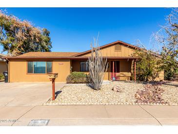 Charming single story home with a well-manicured front yard at 3428 W Vogel Ave, Phoenix, AZ 85051