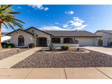 Single-story home with landscaped front yard and driveway at 13907 W Terra Vista Dr, Sun City West, AZ 85375