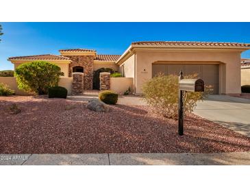 Single-story home with desert landscaping and a two-car garage at 22808 N Los Gatos Dr, Sun City West, AZ 85375