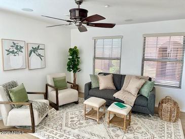 Bright living room with comfy seating and a neutral color palette at 2613 E Bart St, Gilbert, AZ 85295