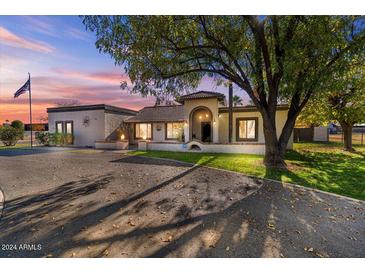 Beautiful ranch home with landscaped yard and long driveway at 2889 E Tremaine Ave, Gilbert, AZ 85234