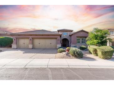 Beautiful desert home with three-car garage and manicured landscaping at 3817 E Cielo Grande Ave, Phoenix, AZ 85050