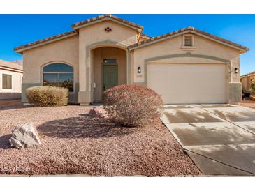 One-story house with a two-car garage and desert landscaping at 4249 S Pony Rider Trl, Gold Canyon, AZ 85118