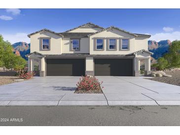 Two-story home with attached garage and desert landscaping at 9831 S 11Th St, Phoenix, AZ 85042