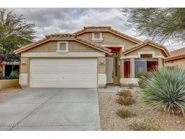 Charming single-story home featuring a well-maintained front yard and two-car garage at 10238 E Blanche Dr, Scottsdale, AZ 85255