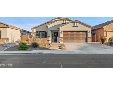 Single story home with a two-car garage and well maintained landscaping at 10808 W Cottontail Ln, Peoria, AZ 85383