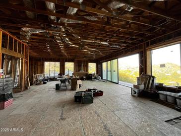 Spacious interior under construction with large windows and mountain views at 4232 E Upper Ridge Way, Paradise Valley, AZ 85253