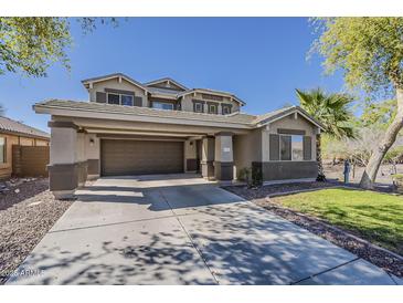 Inviting two-story home featuring desert landscaping, a two car garage, and covered parking at 4275 E Amarillo Dr, San Tan Valley, AZ 85140