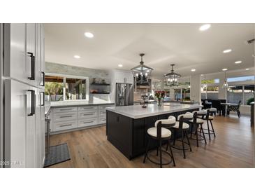 Spacious kitchen featuring modern appliances and a large island at 5012 E Blanche Dr, Scottsdale, AZ 85254