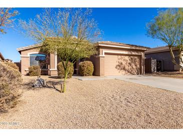 Single-story house with desert landscaping and a two-car garage at 17528 W East Wind Ave, Goodyear, AZ 85338