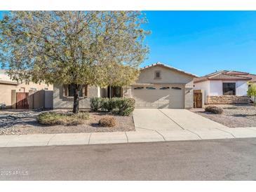 Single-story house with a two-car garage and landscaped front yard at 19847 N 108Th Ave, Peoria, AZ 85373