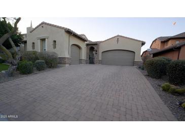 Two-story house with a brick driveway and landscaped yard at 28548 N 68Th Ave, Peoria, AZ 85383