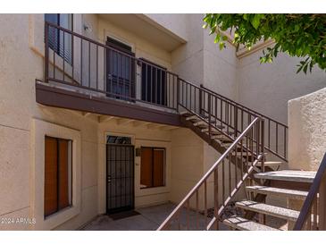 Exterior view showing stairs and entrance to condo at 7101 W Beardsley Rd # 942, Glendale, AZ 85308