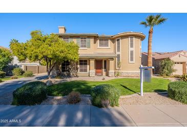 Two-story house with attractive landscaping and a large front yard at 3798 E Latham Ct, Gilbert, AZ 85297