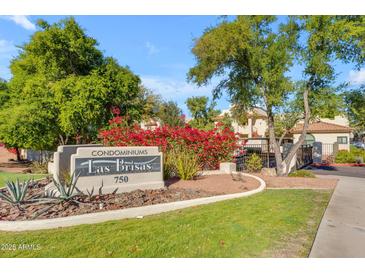 Las Brisas Condominiums building entrance with landscaping at 750 E Northern Ave # 1134, Phoenix, AZ 85020