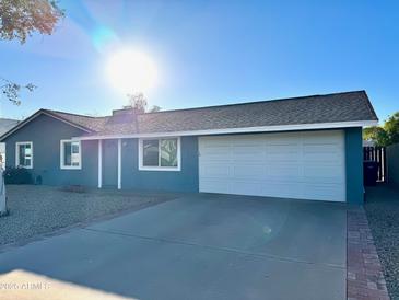 Ranch-style home with two-car garage and front yard at 13428 N 36Th Pl, Phoenix, AZ 85032