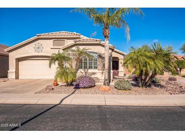 Single-story home with desert landscaping and two-car garage at 18056 W Buena Vista Dr, Surprise, AZ 85374