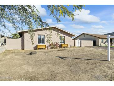 Ranch style home with a large front yard and desert landscaping at 2348 W Laurel Ln, Phoenix, AZ 85029