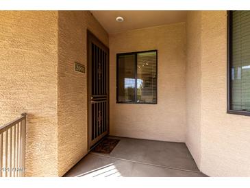 Condo entry with security door, window, and tiled flooring at 3330 S Gilbert Rd # 2001, Chandler, AZ 85286